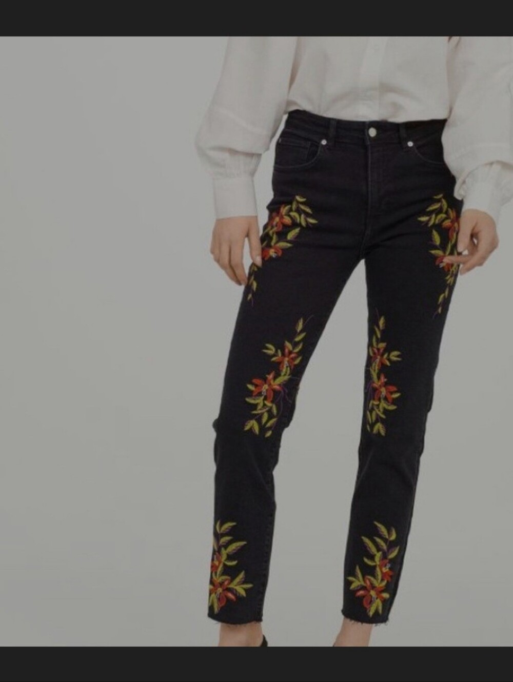 H&M black floral embroidered jeans with raw hem size 4